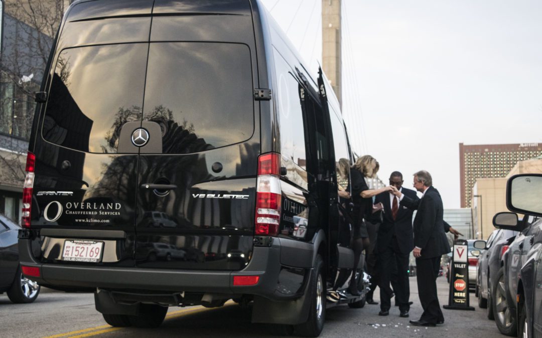 Helping passengers out of a Mercedes Sprinter