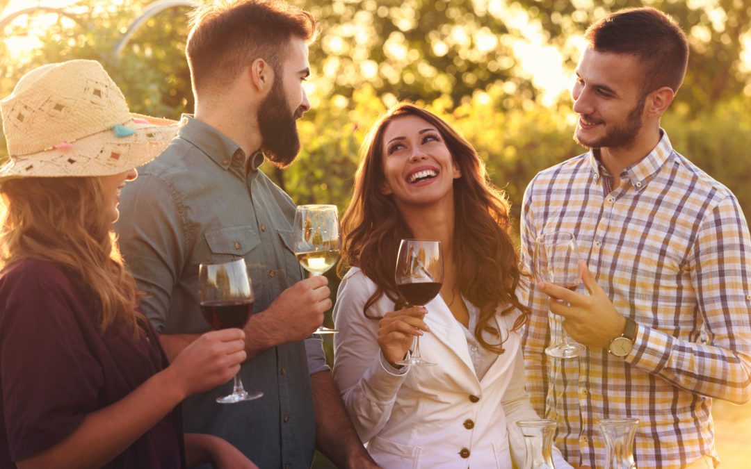 happy friends having fun drinking wine